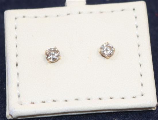 A pair of 14ct gold and solitaire diamond ear studs.